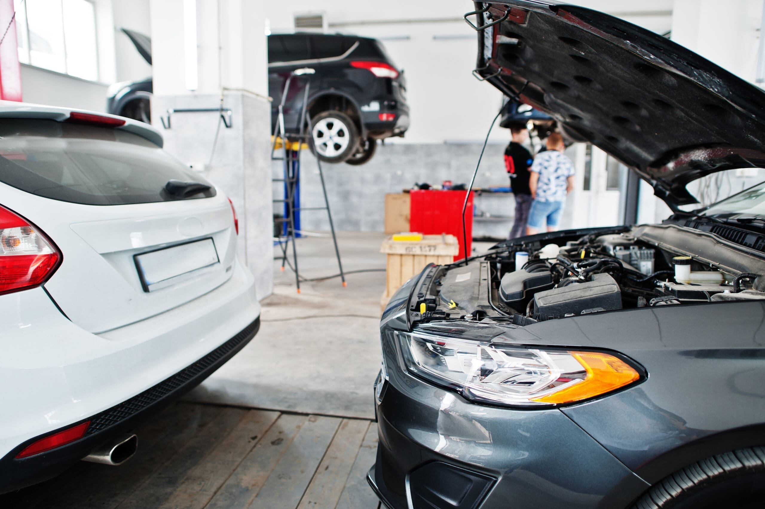 Car repair and maintenance theme. Cars in auto service.