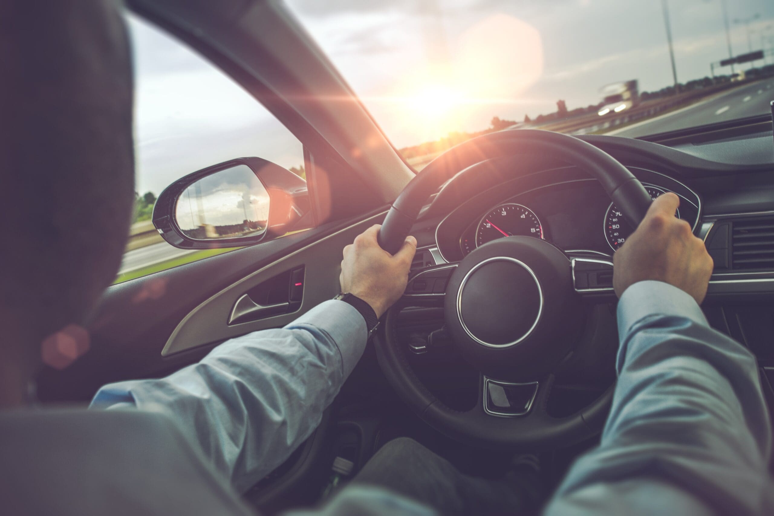 Highway Car Driving. Caucasian Men Behind the Wheel on His Road Trip.